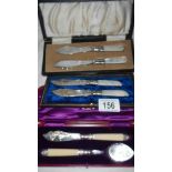 3 cased items of cutlery including knives, spoons etc.