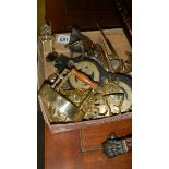 A box of brassware including horse brasses.