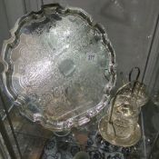 A silver plate tray, egg cup stand and conserve jar on plated stand.