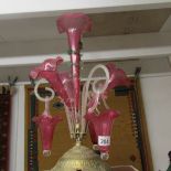 A cranberry glass epergne on brass base (parts do not match).