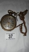 A good old gent's pocket watch with silver coloured dial and complete with key,