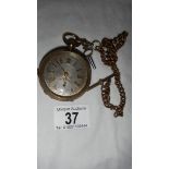 A good old gent's pocket watch with silver coloured dial and complete with key,