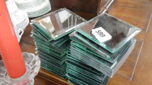 A quantity of bevel edged mirrored coasters.