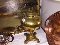 A brass samovar urn.