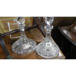 2 cut glass ship's decanters with labels.