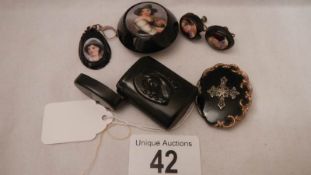 A collection of mourning jewellery including earrings, brooch,