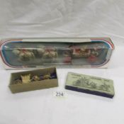 A boxed Corgi coronation coach (box a/f) and a miniature coronation coach.