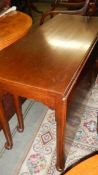 A mahogany drop leaf table.