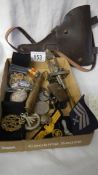 A quantity of war memorabilia including leather gun holster.
