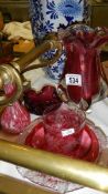 A mixed lot of red glass including cranberry.