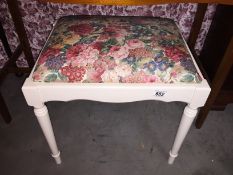 A painted piano stool.