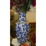 A blue and white floral pattern vase.