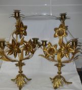 A good pair of gilded brass candelabra, 14" tall.