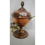 A copper samovar urn.