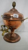 A copper samovar urn.