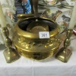 A brass jardiniere, a pair of brass candlesticks and a brass coal shovel.