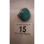 An old silver ring set turquoise, size M, in good condition.