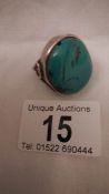 An old silver ring set turquoise, size M, in good condition.