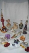 A mixed lot of perfume bottles including some enamelled.