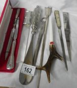 A collection of silver plate and other letter openers.