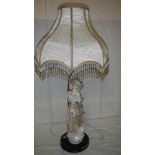 A figural table lamp.