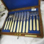 A cased set of fish knives and forks.