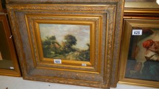 A gilt framed oil on canvas rural scene.