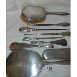 A good lot of silver handled shoe horns, button hooks, dressing table set etc.