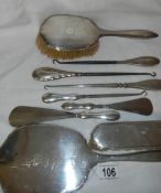 A good lot of silver handled shoe horns, button hooks, dressing table set etc.