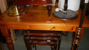 A pine kitchen table.
