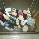 A quantity of shoe and handbag ornaments.