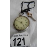 A ladies fob watch complete with key, in working order but may benefit from a clean.