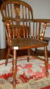 A Windsor chair with crinoline stretcher.