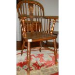 A Windsor chair with crinoline stretcher.