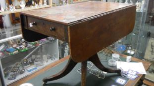 A mahogany Pembroke table on castors.