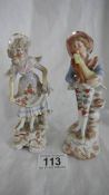 A pair of German porcelain figures, in good condition.
