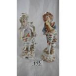 A pair of German porcelain figures, in good condition.