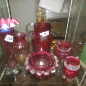 6 items of cranberry glass.