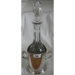 A Victorian glass decanter in silver plated stand, in good condition.