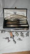 4 silver bladed knives, 2 silver handled button hooks, 4 silver plated animals etc.