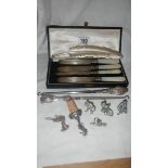 4 silver bladed knives, 2 silver handled button hooks, 4 silver plated animals etc.