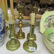 2 pairs of brass candlesticks.