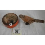 A 19th century circular child's musical box and an old wind up bird.
