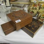 A carved wood box and 2 other boxes.