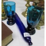 A Bristol blue glass rolling pin and a pair of blue glass vases.