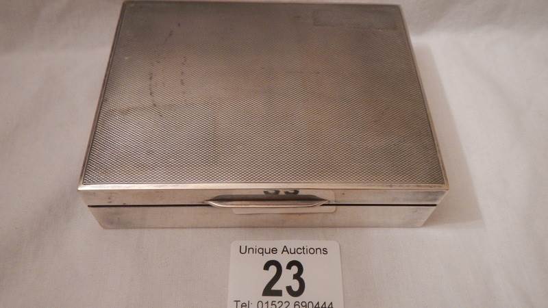 A hall marked silver box with wood lining, 4.5" x 3.5" x 1.25", in good condition.