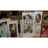 6 boxed porcelain collector's dolls.