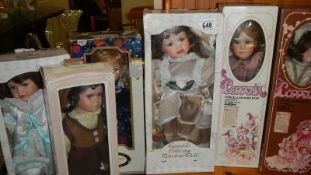 6 boxed porcelain collector's dolls.