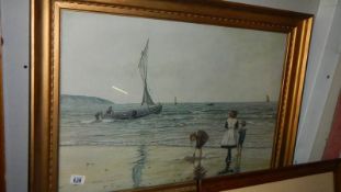 A framed beach scene signed Roderick Lovesay.