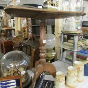 A mahogany tripod table.